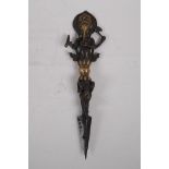 A Tibetan bronzed metal phurba, the handle in the form of Ganesh, 32cm long