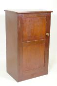 A mahogany single door cupboard with shelved interior, 55 x 39 x 92cm