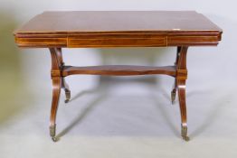 A Continental/Scandinavian satin birch dining table with boxwood line inlay and put out ends, raised