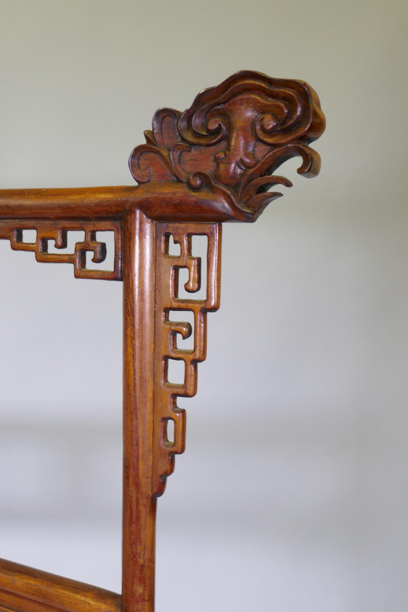 A Chinese carved wood robe rack with decorative pierced panels, 150cm high, 121cm wide - Image 3 of 5