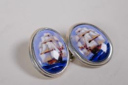 A pair of 925 silver cufflinks set with cold enamel plaques depicting masted ships