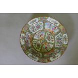 A C19th Cantonese famille rose ceramic bowl, decorated with birds, butterflies and figures, 47cm