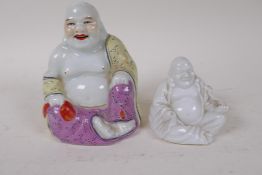 A Chinese porcelain figure of Buddha painted in bright enamels, 10cm high, together with a small