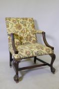 A good late C18th early/C19th Gainsborough chair with carved arms, raised on cabriole supports,