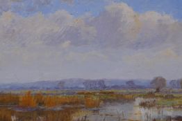 View across a marshland, old label verso R.A.K. Marshall, oil on board, 24 x 15cms