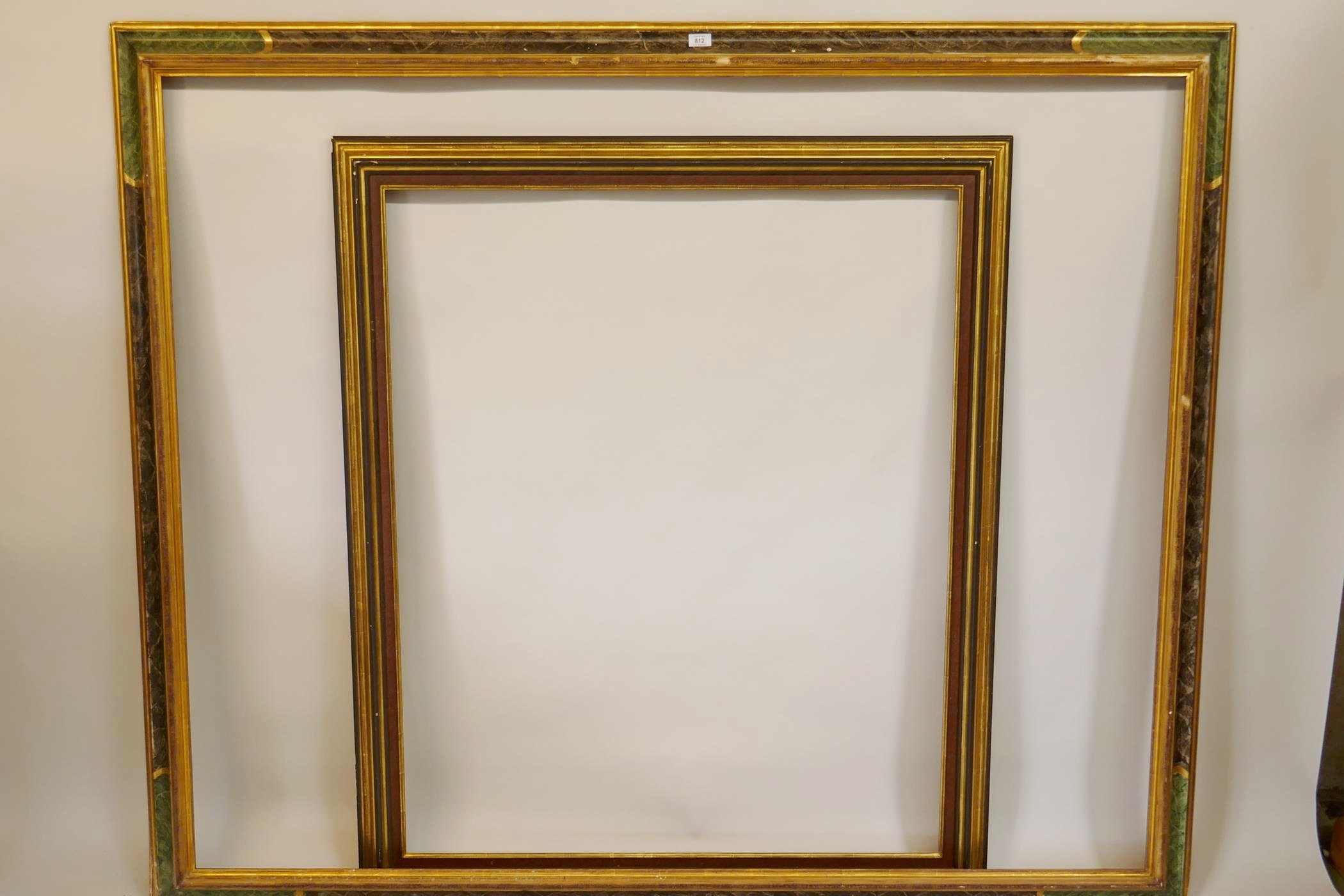 A large painted and parcel gilt frame, 161 x 195cms, and another similar