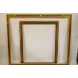 A large painted and parcel gilt frame, 161 x 195cms, and another similar
