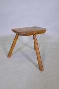 An early C20th blond oak joint stool, 38cm high