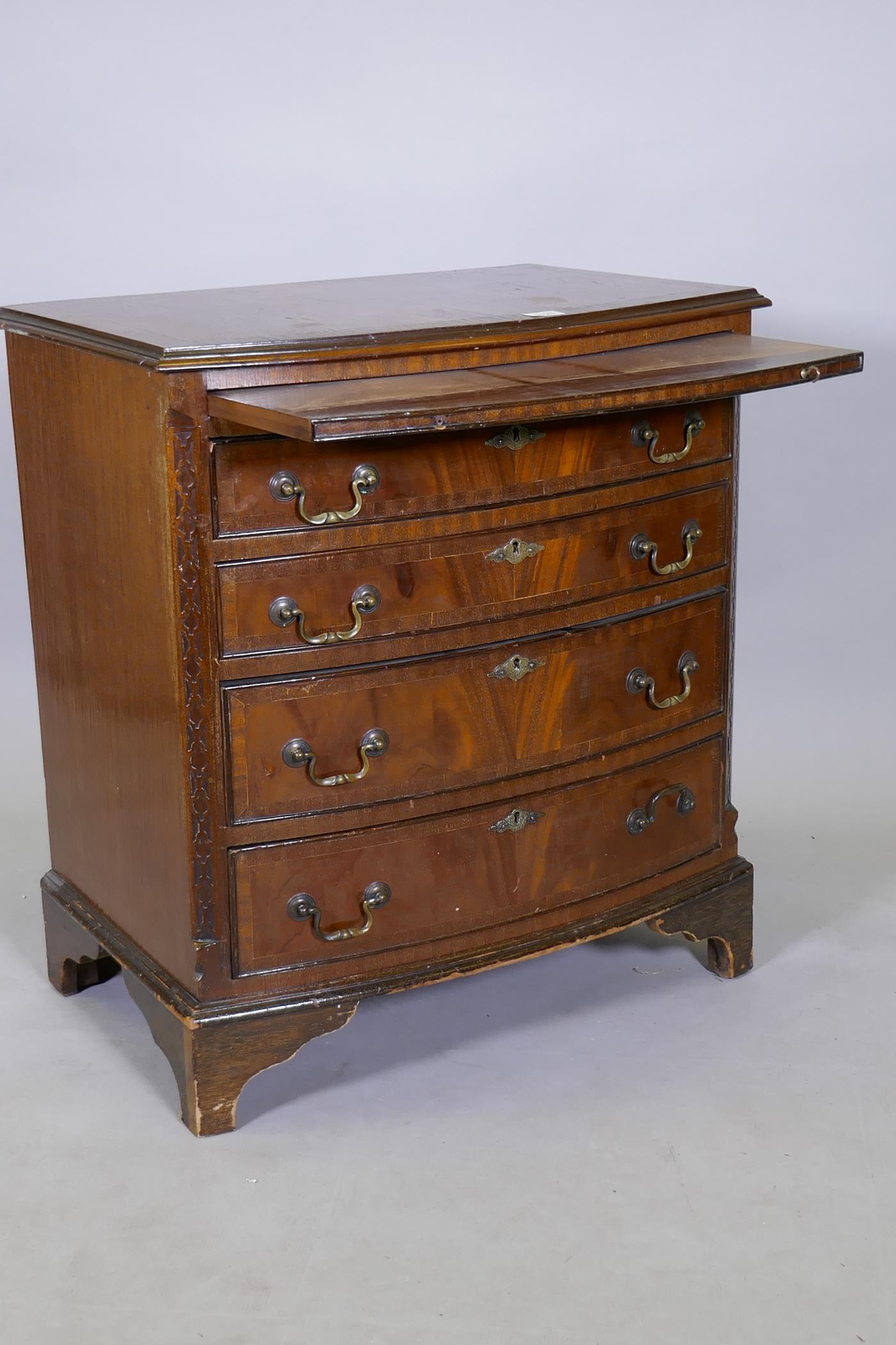 A Regency style mahogany bowfront chest, the brushing slide over four graduated drawers with handcut - Image 3 of 4