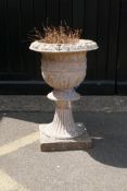 An antique painted terracotta garden urn, 65cm high, 44cm diameter