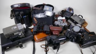 A quantity of cameras and binoculars including four Zenit 35mm, an Olympus IS3000 digital zoom