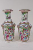 A pair of C19th Canton famille rose vases painted with panels of figures, birds and flowers, 19cm