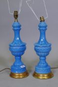 A pair of porcelain table lamps in vibrant blue glaze, on giltwood bases, 47cm high
