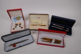 A boxed Tiffany rollerball pen and pencil set, a boxed Shaeffer gold plated fountain pen, a ball