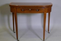 A Georgian rosewood D shaped tea table with fold over top and single drawer, inlaid lining and