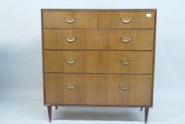 A 1970s Meredew teak chest of drawers, two short over three long, 102 x 46cms, 108cm high