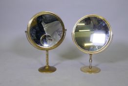 Two vintage brass swing toilet mirrors with enlarging mirrors verso, 43cm high