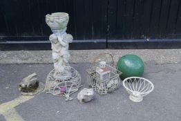 A concrete cherub bird bath, 69cm high, a green glazed terracotta ball finial, 30cm diameter, two