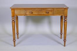 A C19th mahogany single drawer writing table, raised on turned support, 106 x 54 x 75cms