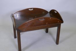 A mahogany butler's tray style occasional table, the top with folding sides fixed to the base, flaps