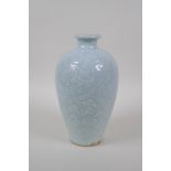 A Chinese celadon glazed porcelain meiping vase with incised scrolling lotus flower decoration, 22cm