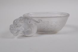 A Chinese moulded glass libation cup with dragon head decoration, raised character marks to bowl,