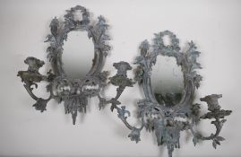 A pair of C19th bronze mirrored candle wall sconces, 44cm long, 1 AF