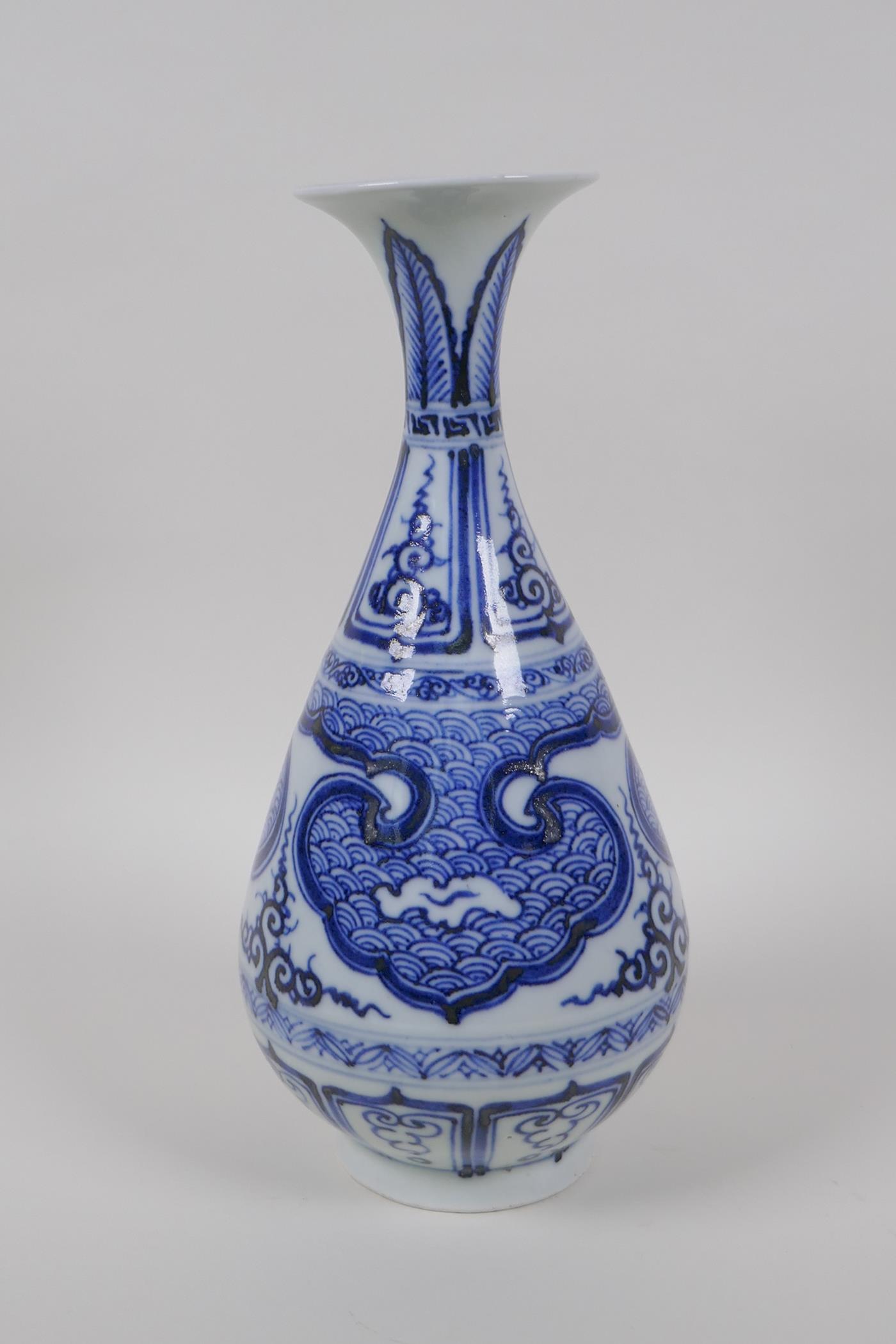 A Chinese early C20th blue and white porcelain pear shaped vase with archaic style decoration,