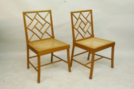 A pair of beechwood lattice back side chairs with carved seats