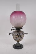 A Doulton Lambeth stoneware oil lamp etched with cranberry glass shade, signed with two Duplex No.2