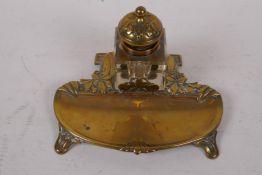 An Art Nouveau brass desk standish with square glass inkwell, 17cm wide