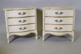 A pair of French style serpentine front bedside commodes with painted and parcel gilt decoration,