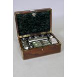 An early C19th rosewood vanity case with brass mounts and inlay, the interior fitted with silver