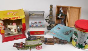 A quantity of children's toys including a Little Betty sewing machine, a Codeg shop till, three