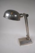 A polished metal adjustable desk lamp from John Lewis, 43cm high