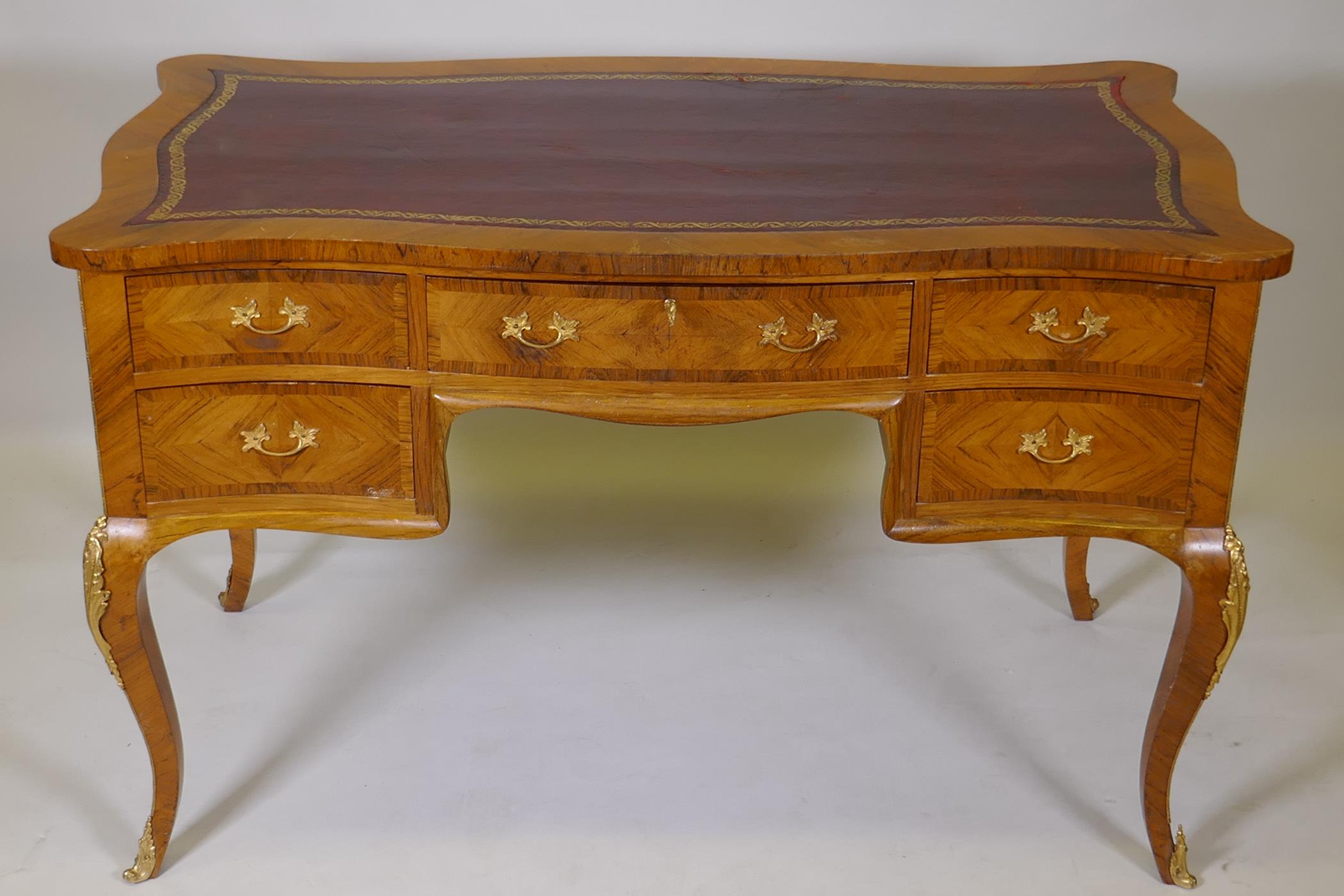 A French tulip wood and rosewood inlaid serpentine shaped five drawer kneehole desk, with gilt - Image 2 of 5