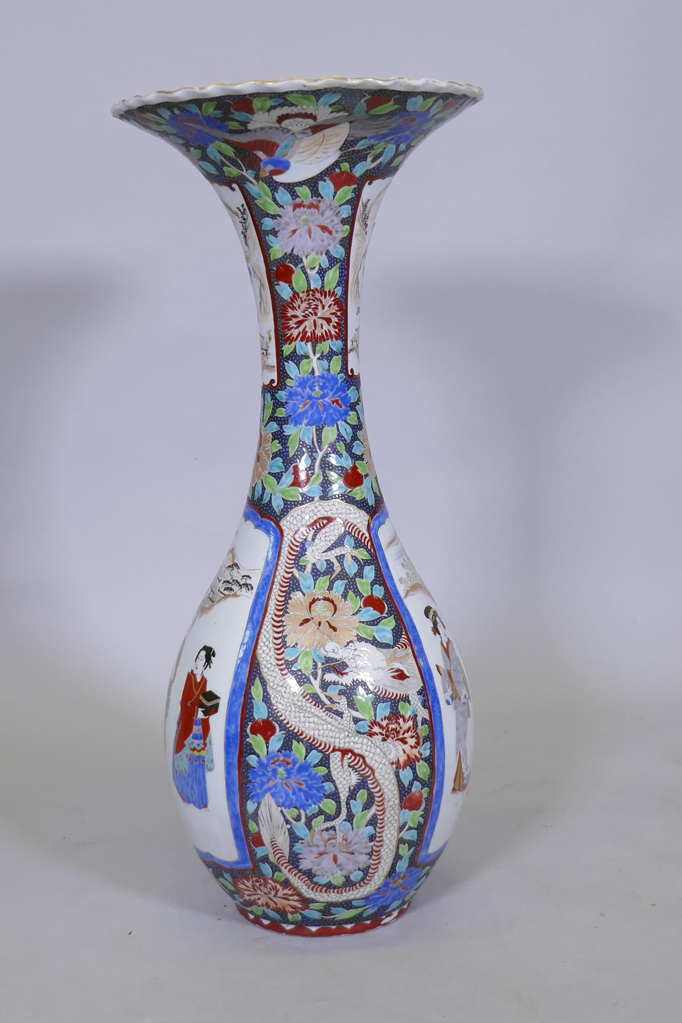 A Meiji Arita floor vase, decorated with two dragons and panels depicting figures in a landscape, - Image 3 of 9