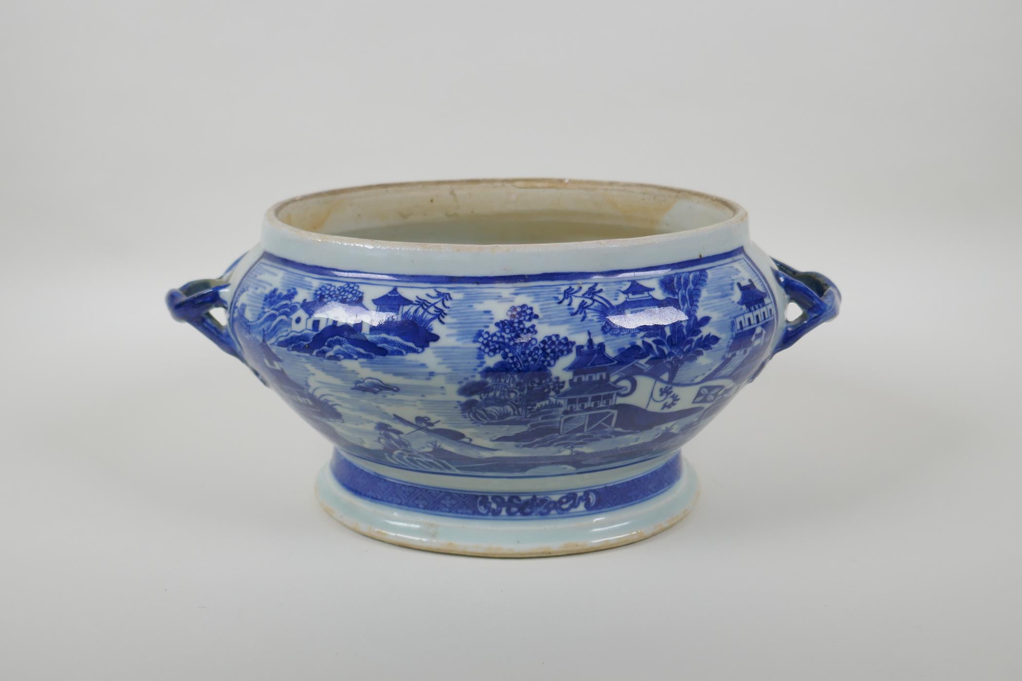 A C19th Chinese export blue and white porcelain two handled oval planter with decorative riverside