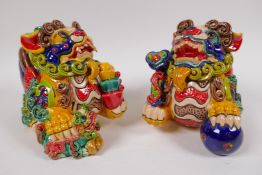 A pair of Chinese polychrome glazed figures of Fo dogs, 12cm high