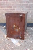 A vintage John Tann's Reliance safe, with wood grain effect decoration, key present, 46 x 46cms,