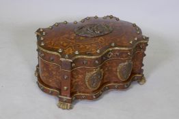 A fine quality Continental C19th inlaid rosewood shaped casket, with ormolu mounts, steel studs