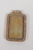 A Chinese white metal pendant set with a jade panel depicting Quan Yin, 4 x 6cms