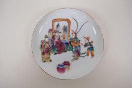 A polychrome porcelain saucer with figural decoration, Chinese Tongzhi 6 character mark to base,