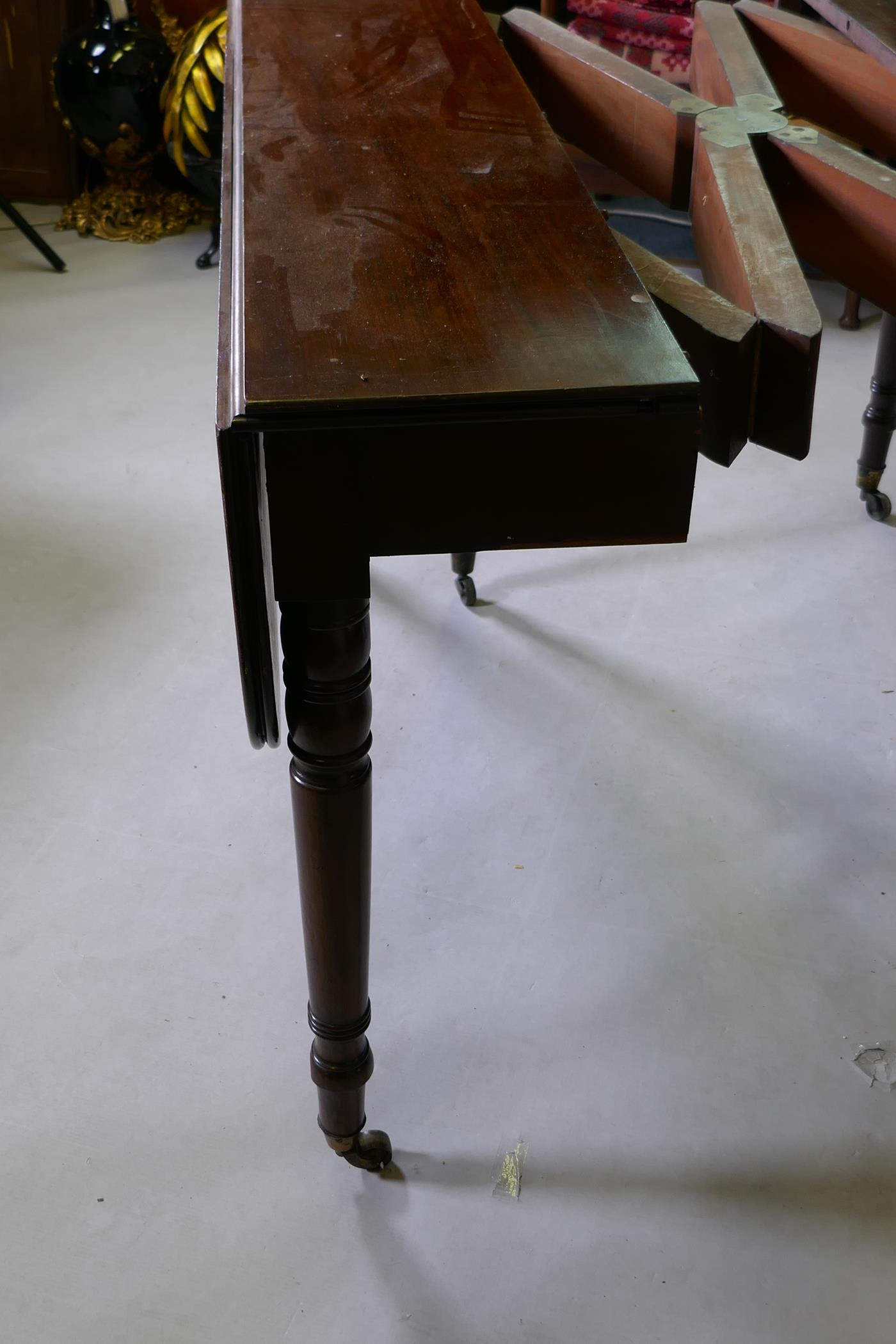 A C19th mahogany drop leaf dining table with concertina action and two extra leaves, one leg AF, 112 - Image 4 of 5