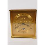 A vintage Looping mantel clock with day/date/month secondary dials and moon phase, in a gilt case,