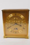 A vintage Looping mantel clock with day/date/month secondary dials and moon phase, in a gilt case,