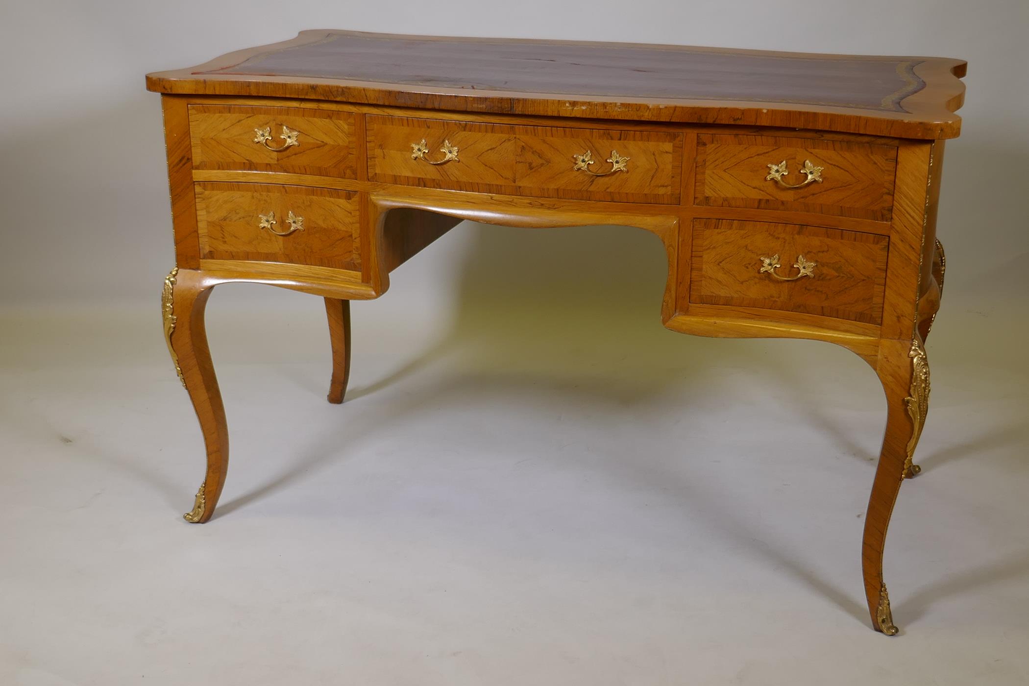 A French tulip wood and rosewood inlaid serpentine shaped five drawer kneehole desk, with gilt - Image 5 of 5