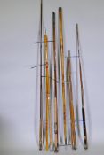 A collection of vintage fishing rods including split cane