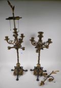 A pair of cold painted brass and three branch table lamps, with silver plated and ormolu detail,