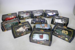Eleven die cast model cars by Burago, Maisto and ANS, nine boxed